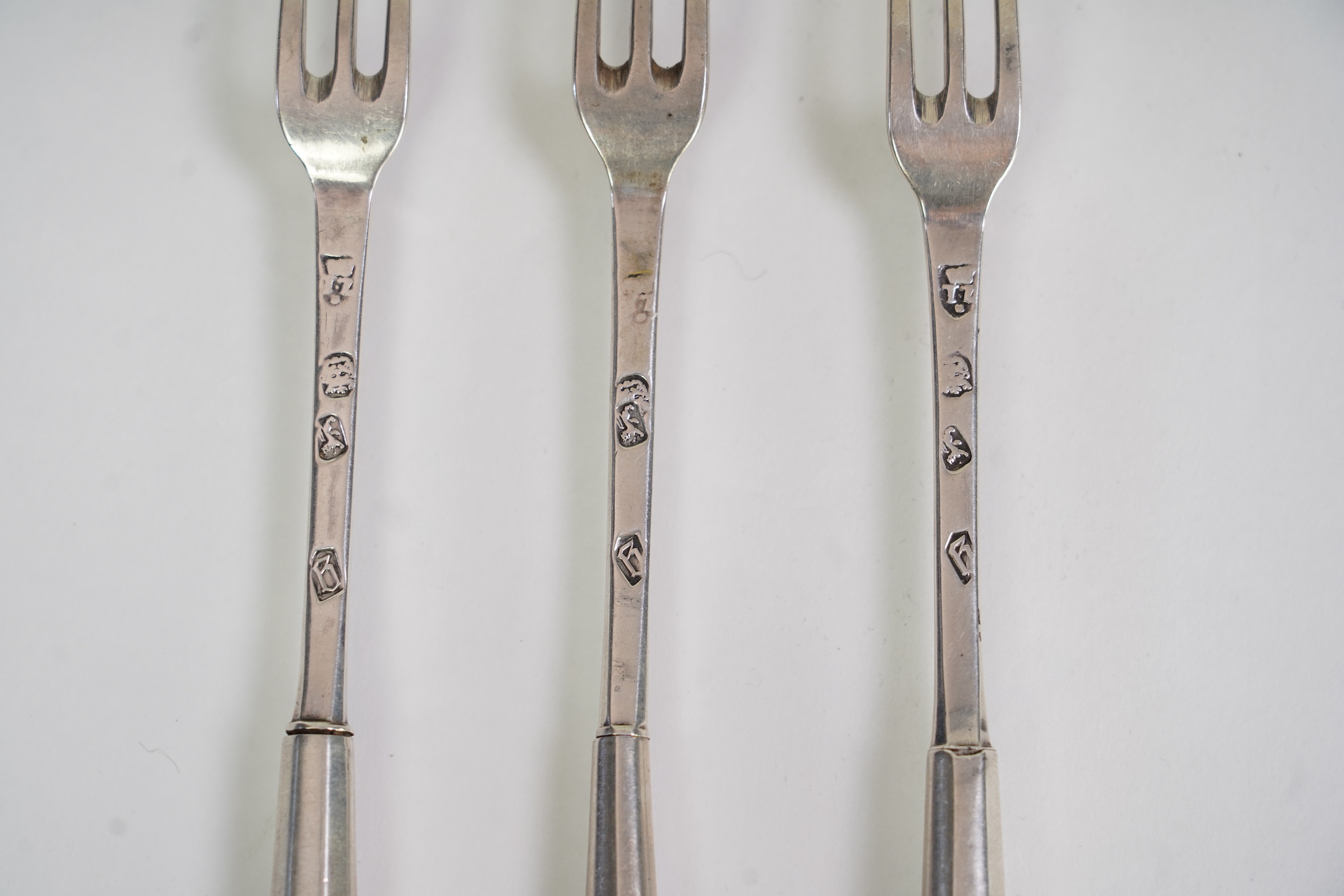 A set of three late Charles II agate handled silver three pronged forks, maker TZ with crown above and mullet below, (Jackson's ref. p.139)